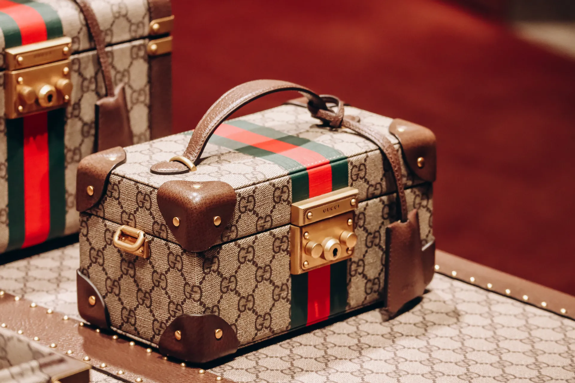 Gucci GG monogram vanity case with signature web stripe