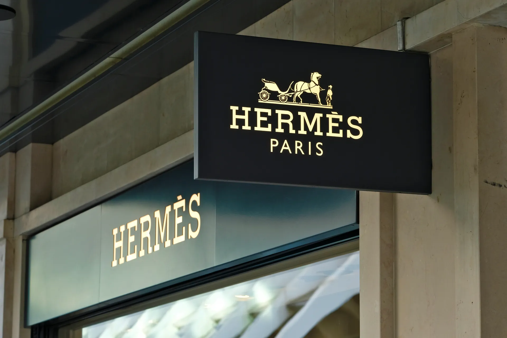 Hermès Paris horse and carriage logo signage on storefront